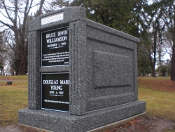 Over-and-under (stack) deluxe mausoleum in deep gray with fluted columns on a foundation/slab in Ypsilanti, MI